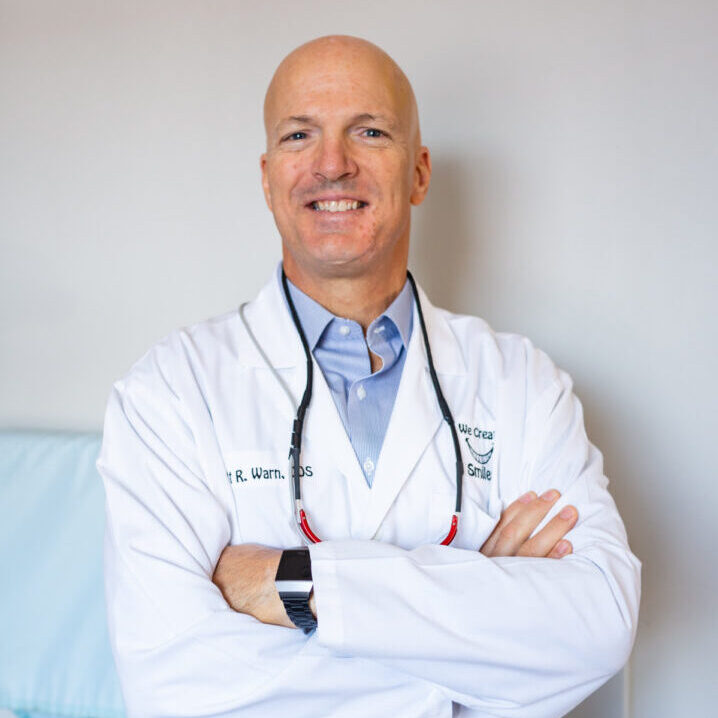 A male doctor with his arms crossed